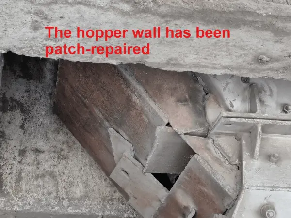 The hopper wall has been patch-repaired