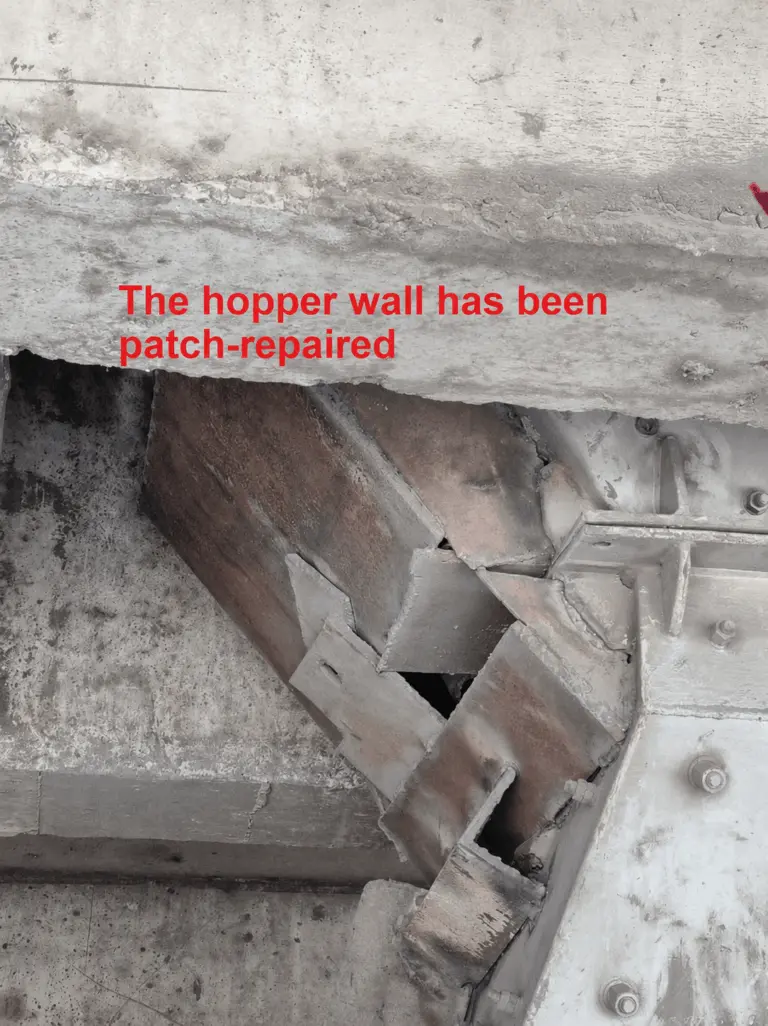The hopper wall has been patch-repaired