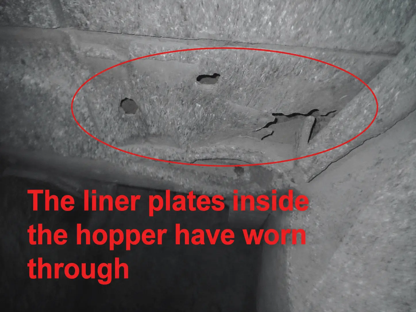 The liner plates inside the hopper have worn through